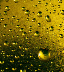Abstract macro of water drops on golden background