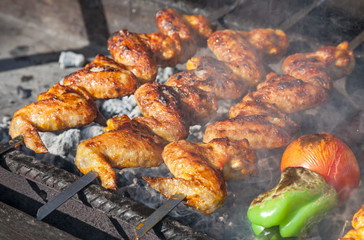 Juicy slices of meat with sauce prepare on fire (shish kebab)