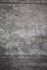 Black metal plate or armour texture with rivets