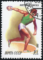 stamp shows Discus throwing with the same inscription