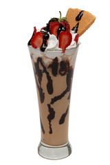 Milkshake with strawberries and chocolate syrup in glass cup
