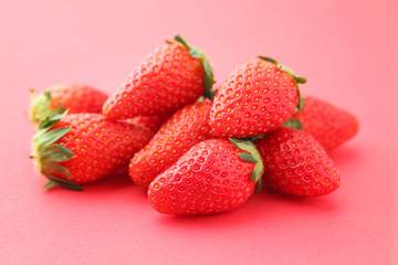 Strawberries on pink background