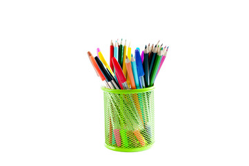Stationery. Colored pencils in a pencil stand over white backgro