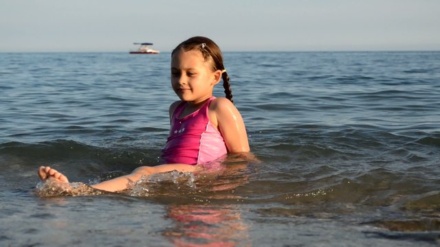 girl swinging on the sea waves