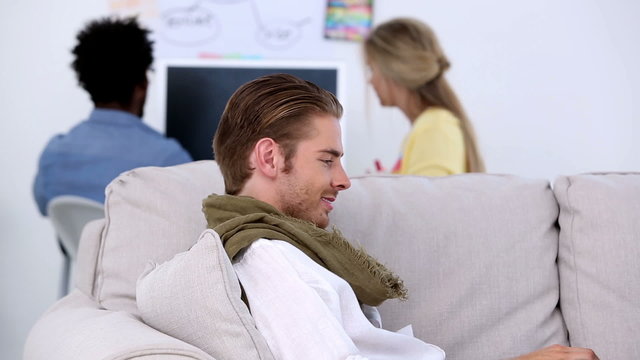 Attractive man working on laptop