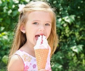 Beautiful little girl eating ice cream