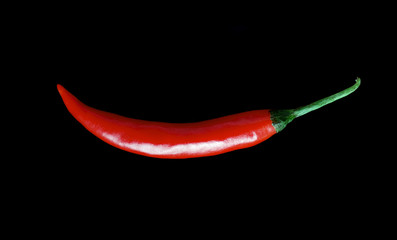 Fresh red hot chili peppers  isolated on black background