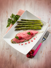 sole fish with raspberry cream and asparagus