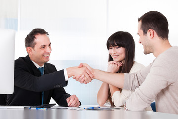 Consultant Shaking Hands With A Man