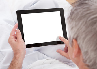Mature Man Using Digital Tablet