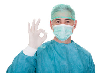 Mature Male Surgeon Gesturing Ok Sign