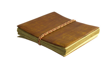 Old book with wooden cover isolated on white background.