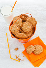 Orange bucket of homemade oatmeal cookies