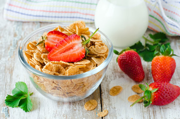 Corn flakes with strawberries , Breakfast .