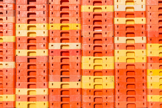 Colorful background of piled plastic crates