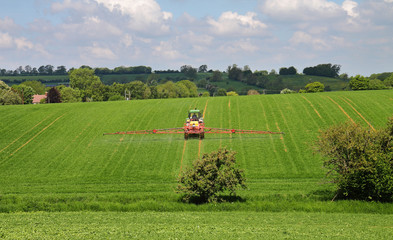 Fototapeta premium Crop Spraying in the Cotswold Hills