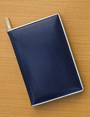 Old notebook on wood background