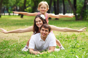 Naklejka na ściany i meble happy family having fun outdoors