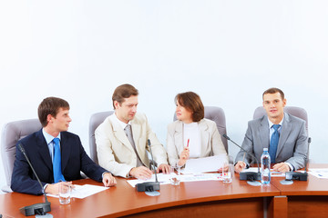 Four businesspeople at meeting