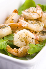 Fresh grilled shrimps on white plate