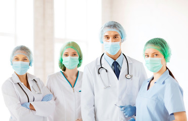 group of doctors in operating room