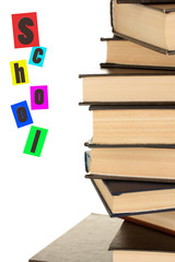 tower of books on white background close-up