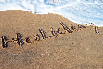 Fototapeta premium Beach and the word holiday