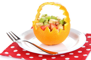 Obraz na płótnie Canvas Fruit salad in hollowed-out orange isolated on white