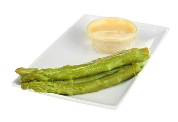 Asparagus on plate, isolated on white