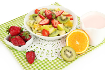 Useful fruit salad of fresh fruits and berries in bowl isolated