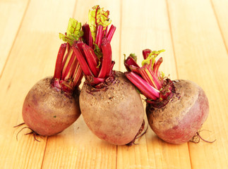 Young beets on wooden table close-up