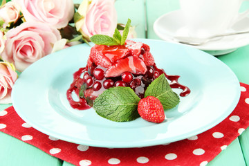Tasty jelly dessert with fresh berries, on bright background