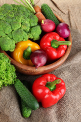 Fresh vegetables on burlap background