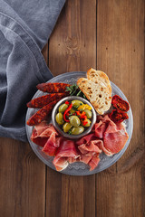 Platter of serrano jamon Cured Meat, Ciabatta, chorizo and olive