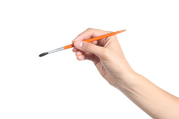 Woman hand using a little paintbrush