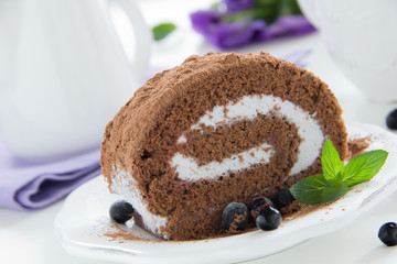 Chocolate roll with cream.