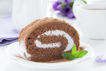 Chocolate roll with cream.