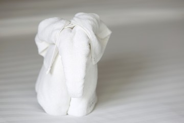 Fototapeta na wymiar Towel elephant on the bed