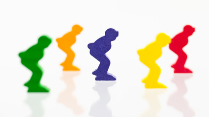 Fototapeta na wymiar Five colored pawns isolated on a white background