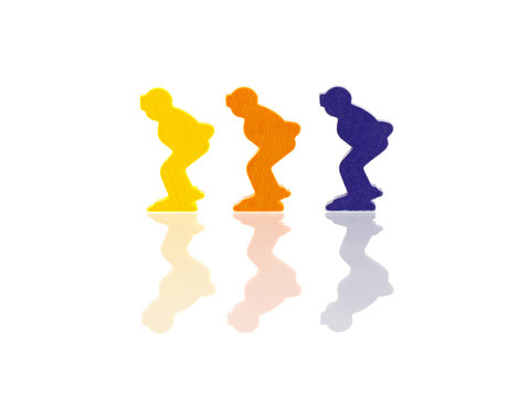 Three colored pawns isolated on a white background