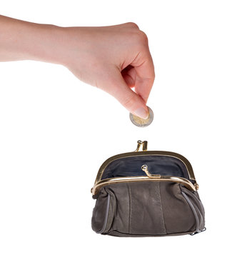 human hand put euro coin in purse on white