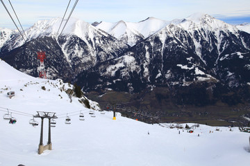 Ski slopes with lifts and skiers