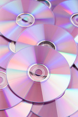 Many CD or DVD disks on each other