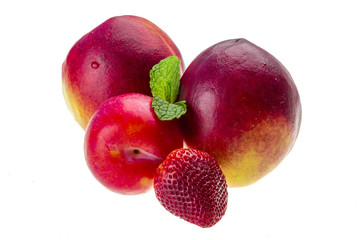 Ripe bright peaches, plum, strawberry and mint