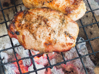 Pork steak on the grill, low heat stove.