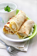 Stuffed creppes with sour cream