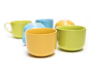 colorful cups on white background.