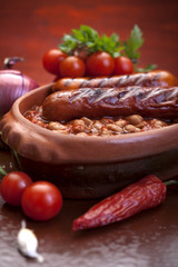 plate of baked beans and sausage