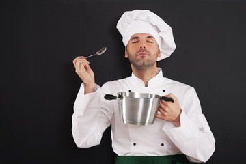 Chef enjoying the aroma of a soup