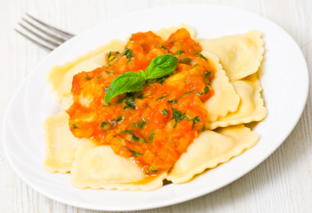 ravioli with tomato sauce and basil